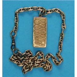 A small engraved gold vesta, on cable link chain...