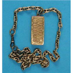 A small engraved gold vesta, on cable link chain...