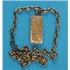 Image 1 : A small engraved gold vesta, on cable link chain...