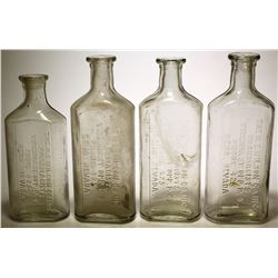 Four N. E . Wilson Co. Bottles