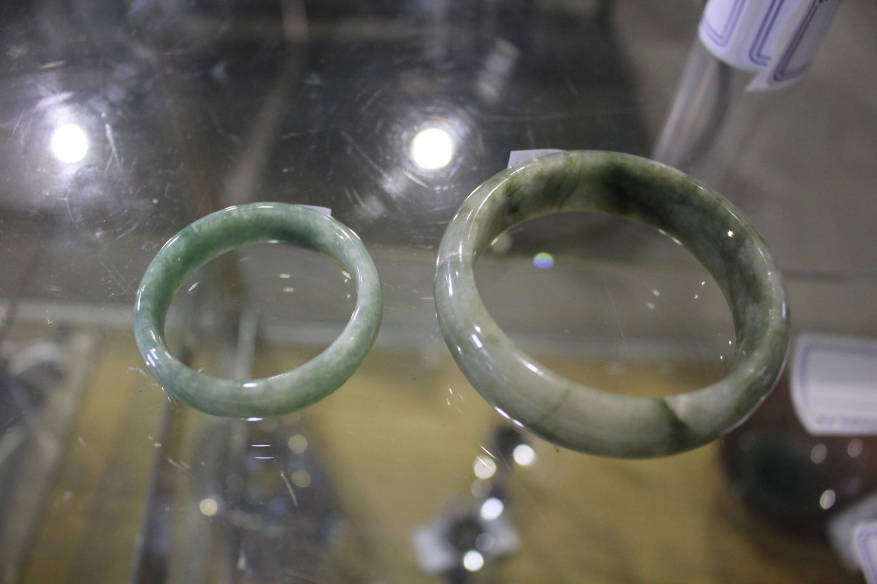 TWO JADE BANGLES Able Auctions