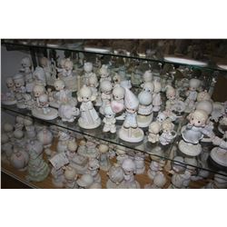 LARGE SHELF LOT OF ASSORTED ENESCO PRECIOUS MOMENTS COLLECTABLE FIGURINES