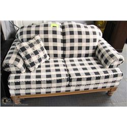 CHECKERED FABRIC 63" SOFA WITH ACCENT CUSHION.