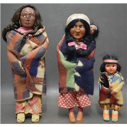 THREE SKOOKUM DOLLS