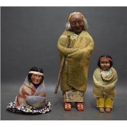 THREE SKOOKUM DOLLS