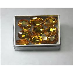 7)  LOT OF 10 OVAL YELLOW ZIRCON