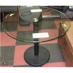36" ROUND GLASS TOP PEDESTAL TABLE.