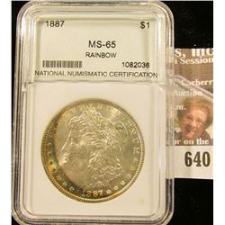 1887 Morgan Silver Dollar Slabbed And Graded Ms 65 Rainbow Toning.  This Books For $185
