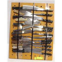 CUTTING BOARD 25" X 20" AND 25 KITCHEN KNIVES.