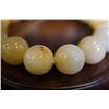 Image 4 : A Jadeite Bead Bracelet(Shou chuan) with one of the beads cut in a Pixiu Shape