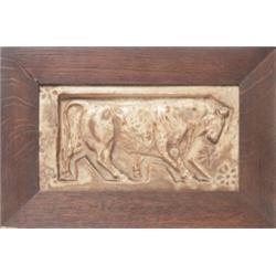 Bigot tile, deeply carved ox 