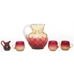 Moser pitcher with a Amberina pitcher and cups