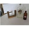 Image 1 : Wooden Vise Grip, 2 bottles, 1 - 1845 Brown hospital bottle, 1 - Sask Liquor 1940s 11" high