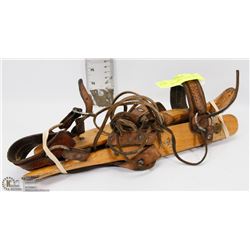 VINTAGE WOODEN STRAP ON SKATES.