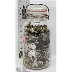 VINTAGE JAR FILLED WITH LOTS OF KEYS.