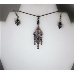 19) RED CRYSTAL FILAGREE PENDANT ON
