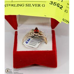 79) STERLING SILVER GARNET RING