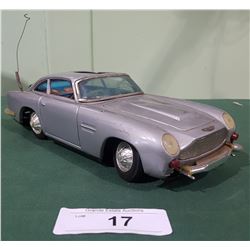 VINTAGE JAMES BOND 007 ASTON MARTIN DBS BATTERY POWERED TIN TOY