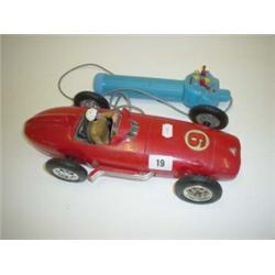1950s red plastic Mercedes racing car with hand held battery operator, 14" long
