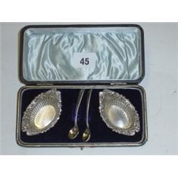 Birmingham 1897 silver cased set of oval repose salt cellars plus two spoons
