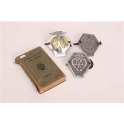 Three vintage AA car badges plus copy of AA Hotel Handbook 1939-40 (worn)