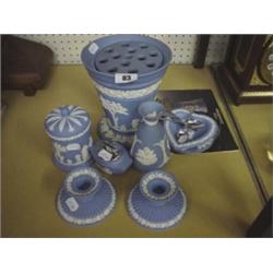 Eight pieces of Wedgwood blue Jasper ware to include vases and candlesticks