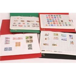 Four folders containing stamps, mostly Great Britain, Europe and North America
