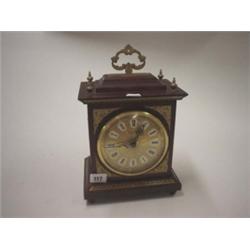 Mahogany cased mantle clock with brass dial and quartz movement