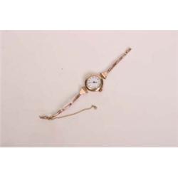 9ct gold lady's wristwatch with enamel face and gold bracelet strap