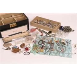 Vanity case full of costume jewellery, brooches beads and necklaces