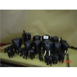 Quantity of ebonised elephants (approx. 20) some with tusks, various sizes