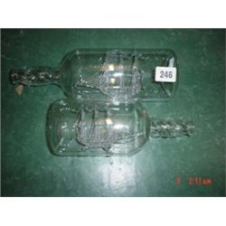 Two ships in glass bottles