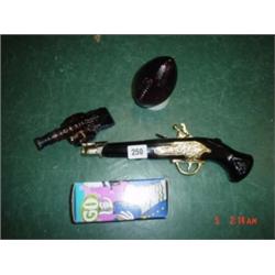 Four Avon pieces, ruby ball, pistol, cannon and American whistle in box