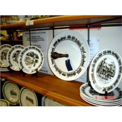 Commemorative humorist railway pottery, comprising of cake dish and eleven tea plates