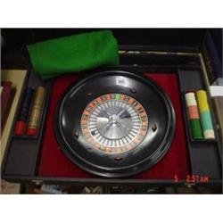 Cased table top roulette game complete with wheel, counters and dice