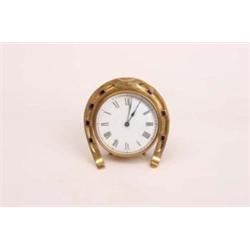 Early 20th century drum mantle clock with heavy bevelled glass face decorated with brass horseshoe i