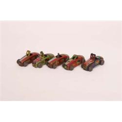 Five miniature tinplate racing cars with flats of the nations on bonnets