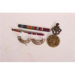 Two Foresters badges, Royal cap badge and Eastbourne Officer Training badge and two bars
