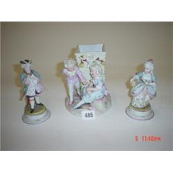 Continental spill vase and two German figures.