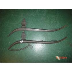 Pair of cast black horse haines