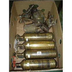Box of four Brass fire extinguishers and three blow lamps and a sprayer.