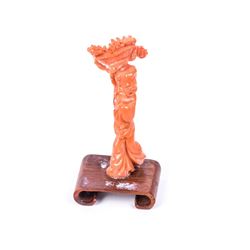 A woman carrying a basket of flowers - old red coral carving