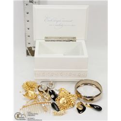 WIND UP MUSIC BOX FILLED WITH JEWELRY.