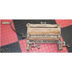 ANTIQUE RINGER EXTRACTING WATER FROM CLOTHES WHEN