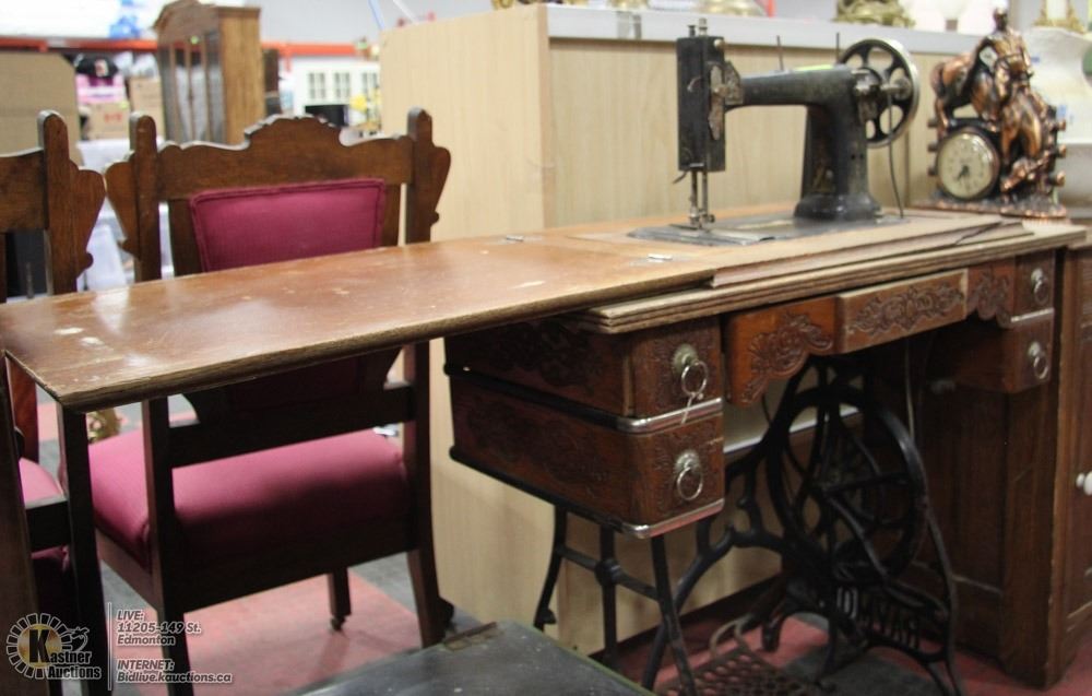 ANTIQUE RAYMOND TREADLE SEWING MACHINE.
