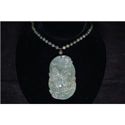 A big Guan Yin pendant with the bead chain.