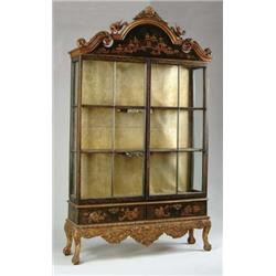 OUTSTANDING JAPANNED TWO PART GLASS FRONT CABINET.