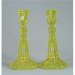 PAIR OF ANTIQUE FLINT GLASS CANARY CANDLESTICKS.