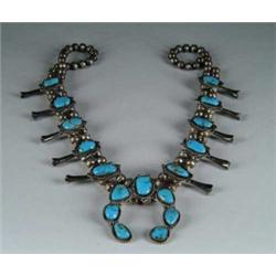 TURQUOISE AND SILVER SQUASH BLOSSOM NECKLACE.