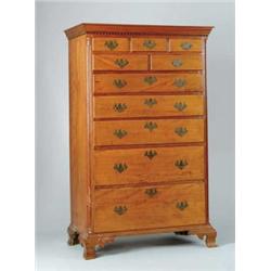 TEN DRAWER GRADUATED CHERRY & MAPLE TALL CHEST.